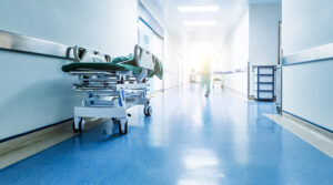 Doctors or nurses walking in hospital hallway, blurred motion
