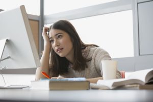 Frustrated college student studying at computer face palm, d'oh, sad, embarrass, stress