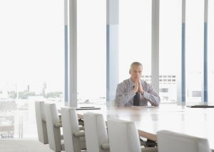 single lawyer solo practitioner at conference table alone